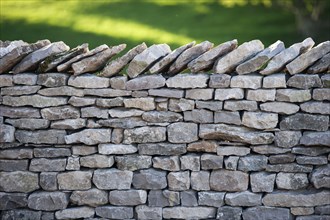 Close-up of a dry stone wall built from limestone