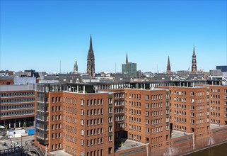 View from the Elbe Philharmonic Hall to the Michel and the office buildings at Sandtorhafen in Hafencity