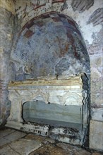 Broken open historical marble sarcophagus of Saint Nicholas in former Byzantine church