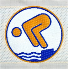 Gold swimming badge