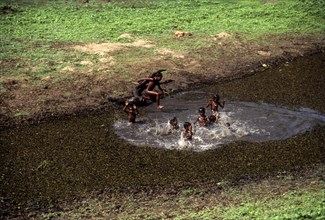 Tribal Children enjoying bath at balle