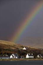 Rainbow over the houses on Craighouse Island Jura