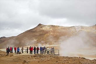Geothermal activity with tourists on viewing platform