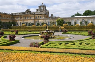 Italianate gardens with fountain and country house
