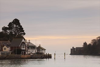 View of harbour entrance with Dartmouth Castle and Royal Dart Yacht Club at sunrise