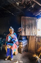 Woman in hut