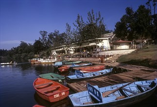 Colourful Boats in front of boat house