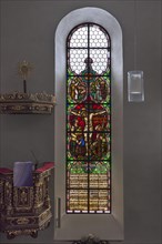 Church window with pulpit in the interior of St Matthew's Church