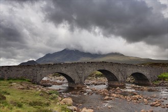 View of Moor River with old Sligachan Bridge and mountains