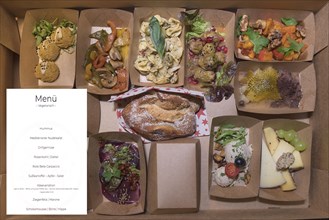 Online ordered menu with meat and vegetables delivered in boxes
