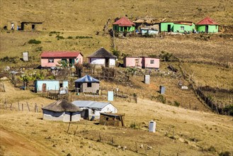 Hilly landscape characterised by the colourful huts