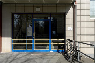 Rollator in front of the entrance to an apartment building in Berlin Mitte