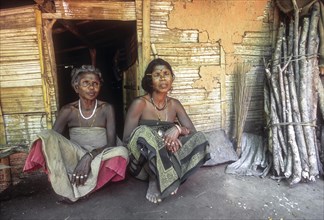 Mudunga tribal women sitting in front of the hut a tribal village near Silent Valley