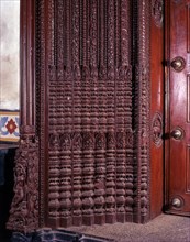 Richly carved wooden door of an old house portal in kanadukathan