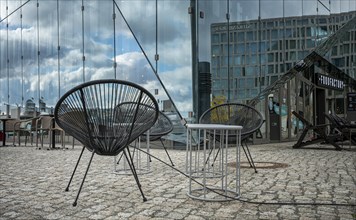Modern chair in front of the Cube building at the main station