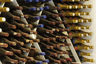 Close-up of wine bottles stored in the cellar