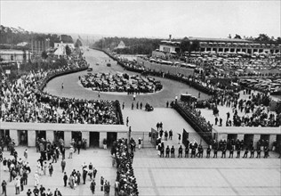 Adolf Hitler enters the stadium through the South Gate