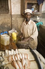 Fishmonger at the urban fish market