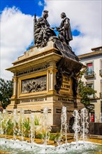 Monument with Columbus and Queen Isabella I of Castile in the Plaza de Isabel la Catolica in Granada