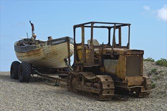Tractor lands fishing boat on beach
