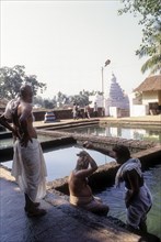 A ritual being performed at Kashi Bhageerathi theertha in Kadri Manjunath Temple