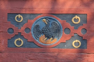 Wood carving with firebird at the historic Amthof in Bad Camberg