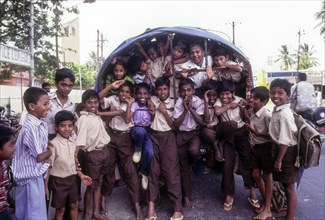 Children going to school in bullock cart at Coimbatore