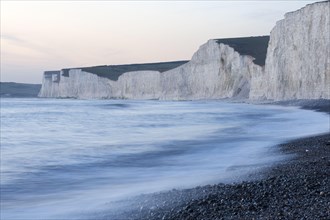 View of the chalk cliffs on the coast at dusk