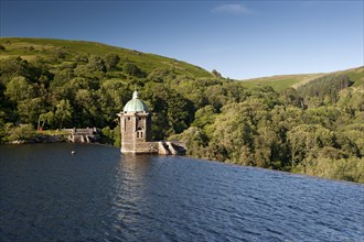 Dam spillway and pump house at reservoir