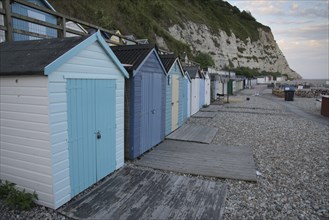 Wooden beach huts in the late evening