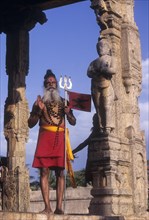 A Sadhu standing in Nandhi mandapam at Thanjavur Brihadeeswarar