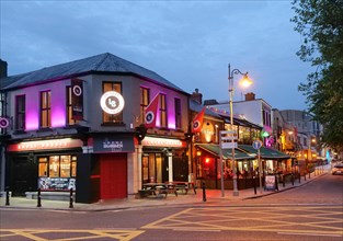 Irish pubs in evening light at Georges Quay