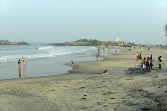 Holidaymakers on the beach of Kovalam