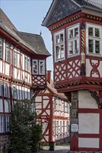 Medieval half-timbered houses with bay windows at the corner of the house
