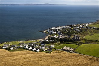Aerial view of coastline and village