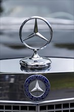Radiator mascot Mercedes star with logo on classic car Mercedes-Benz 300 SEL Automatic