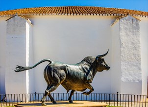 Bronze bull in front of the bullring