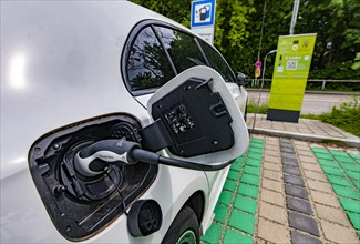 A Mercedes car with electric drive is charged at a charging station in Erding