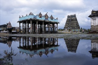 Natraja temple north tower and mandap along with its reflection in the rain water