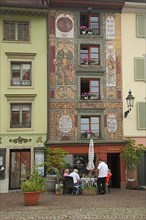 Street pub with mural on Muensterplatz in Bad Saeckingen