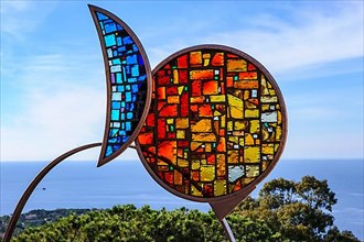 Artistic sculpture glass mosaic of stylised fish