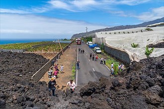 Destroyed road under the lava flow of the new volcano Tajogaite from the 2021 eruption