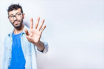 Portrait of people counting number five on isolated background. Person hand counting number five. Handsome man hand showing number five