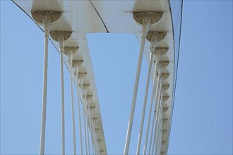 Detail of the modern steel structure with struts and fork heads of the Pont Beatus Rhenanus tram bridge over the Rhine near Kehl