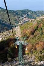 Cable car Cabinovia Monte Capanne with open standing gondola on Monte Capanne mountain