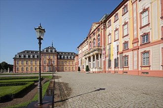 Inner courtyard with ornamental garden and street lamp of the baroque castle