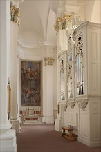Interior with organ and painting of the neo-baroque Jesuit Church in the Old Town