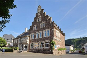 Historic and former primary school with stepped gable in Puenderich on the Moselle