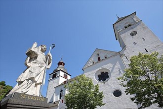 Sculpture Saint Castor in front of the Romanesque collegiate church or Moseldom in Karden