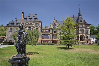 Lieser Castle built in 1885 in historicism with gardens and black sculpture in Lieser